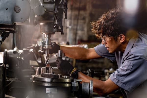 A focused mechanical fitter at work