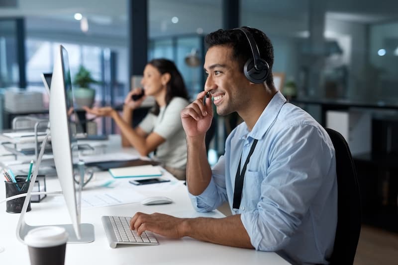 Smiling customer service worker on a call