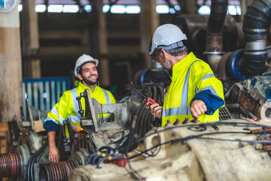 Factory Engineers Inspecting Machinery on the Job