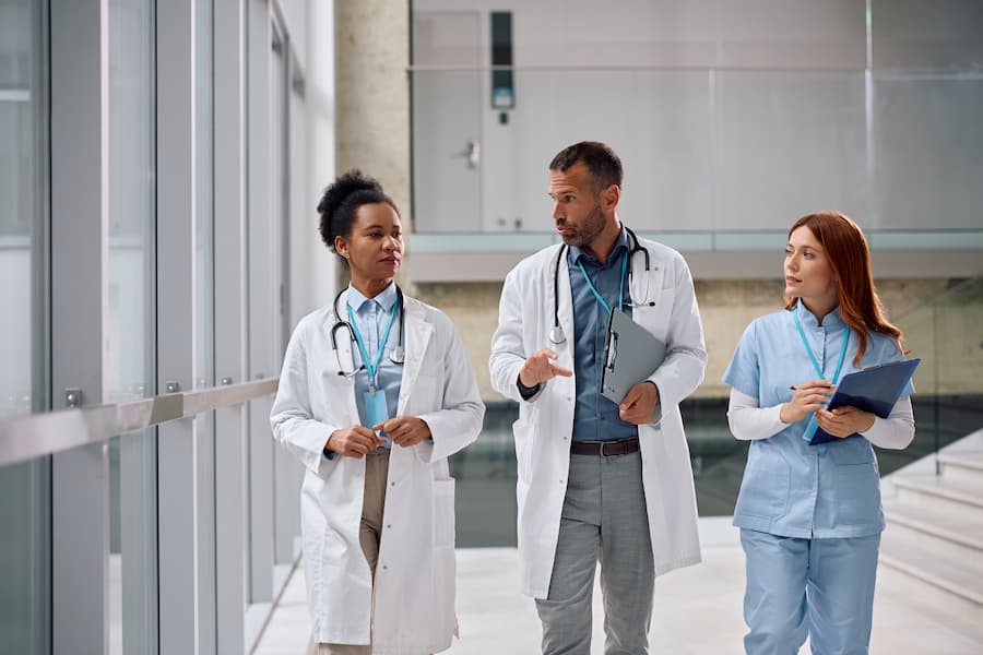 Multiracial team of doctors discussing while working at the clinic.