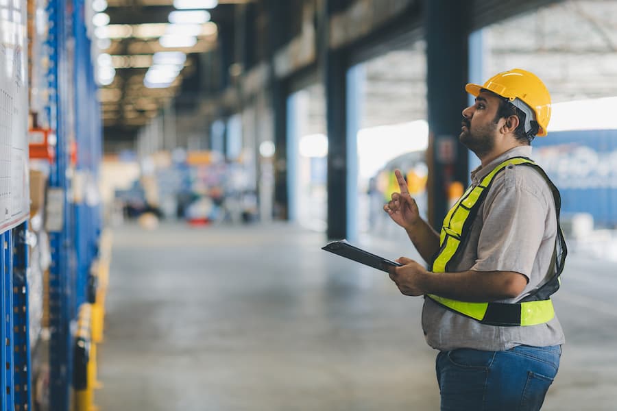 Warehouse worker working in warehouse storage.