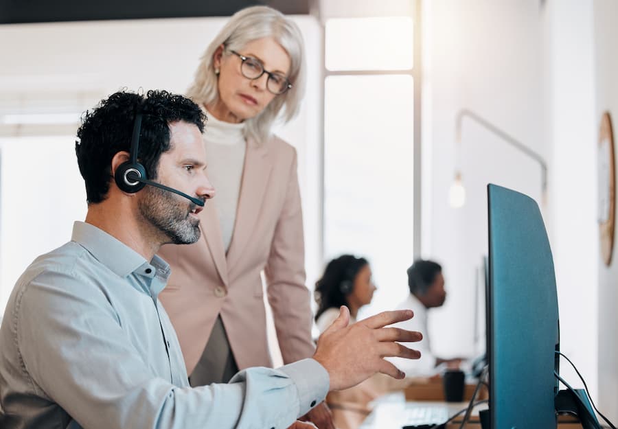 Business Colleagues Discussing Work at a Call Center