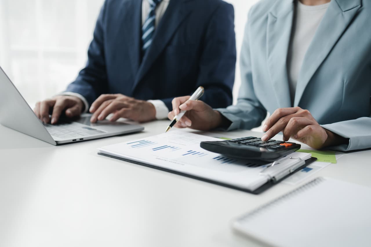 Business Professionals Reviewing Financial Data in Office