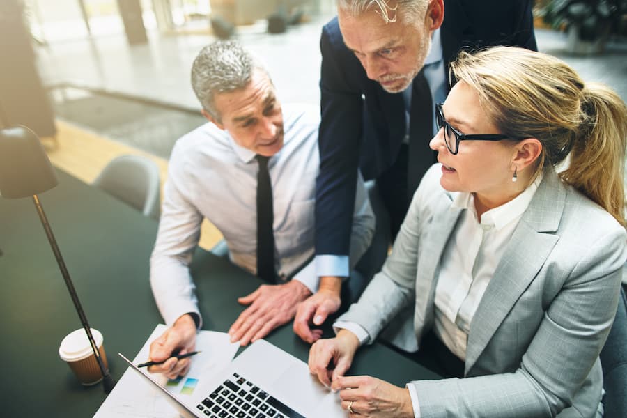 Business Team Collaborate Around Computer At The Office