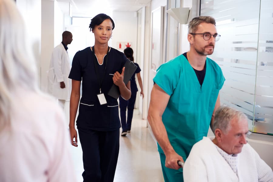 Busy Hospital Corridor With Medical Staff And Patients