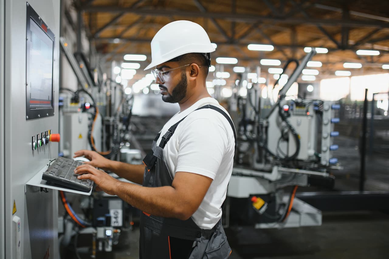 Machine operator focused at work in a manufacturing environment