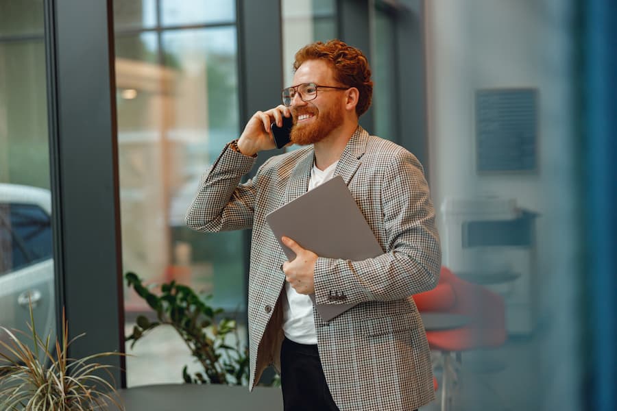 Focused Man Working and Talking on His Phone