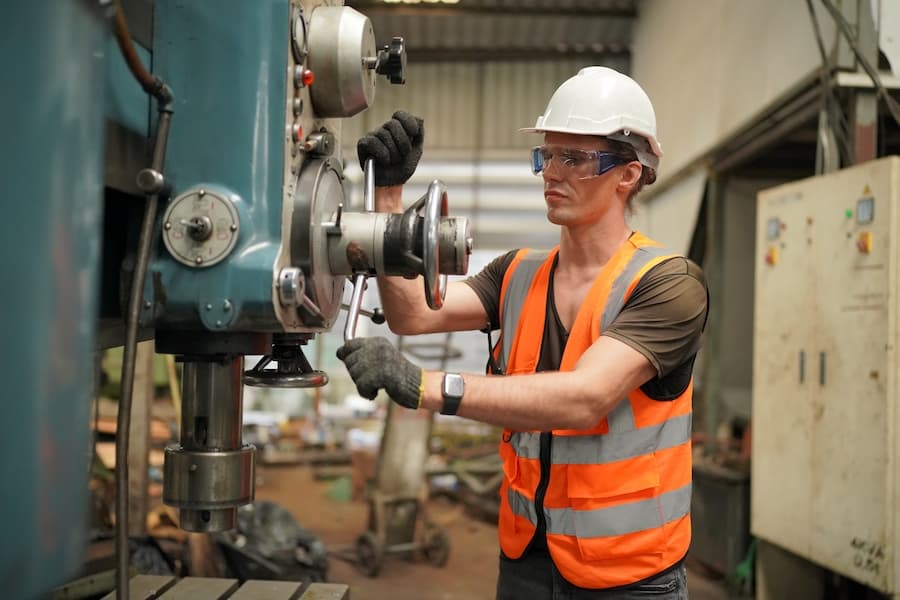 industrial factory employee working in metal manufacturing industry