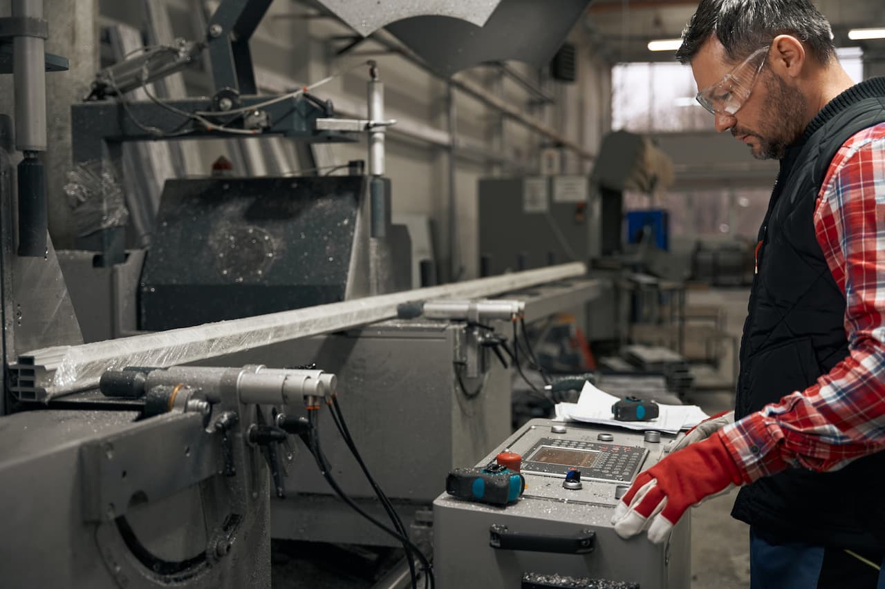 production operator operating machinery packaging line factory