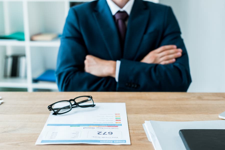 Professional Man in Office with Credit Report