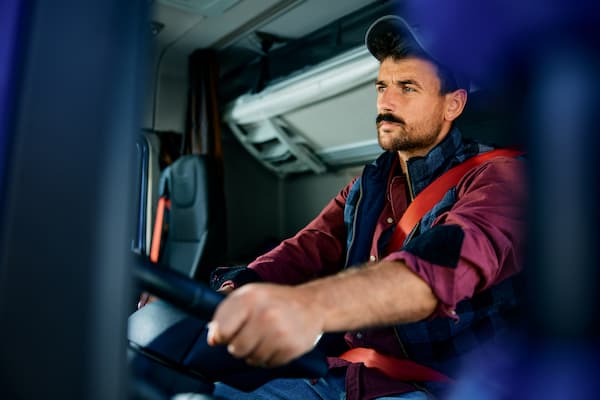 Professional Truck Driver at Work in Vehicle