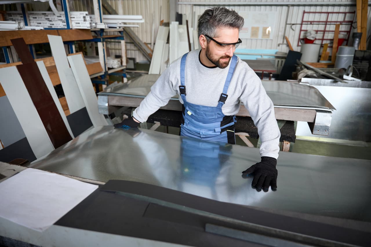 Man works in a modern production facility