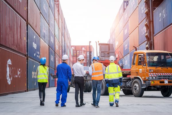 Team of Workers at a Shipping Port Facility