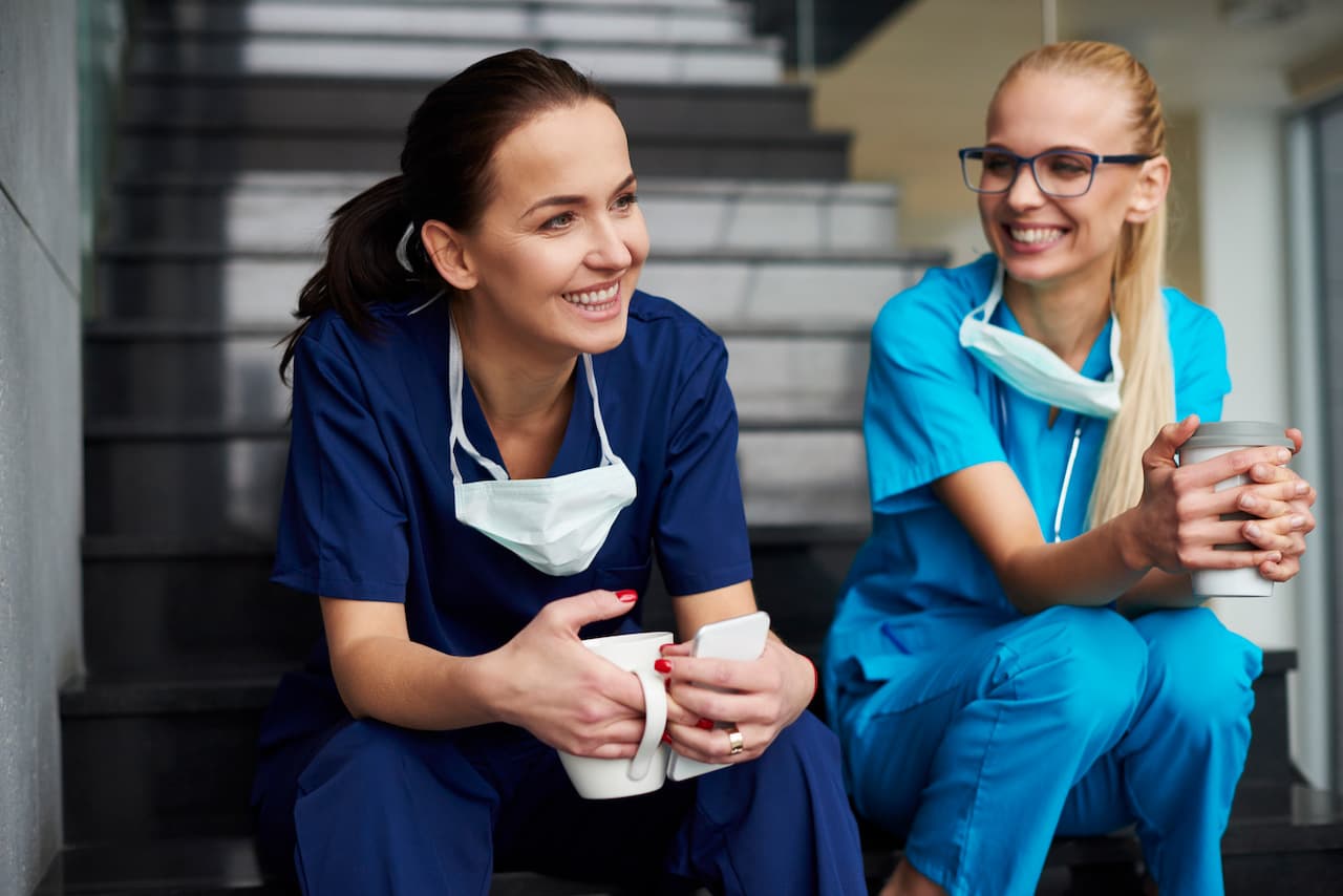 Two Smiling Medical Professionals Taking a Break Together