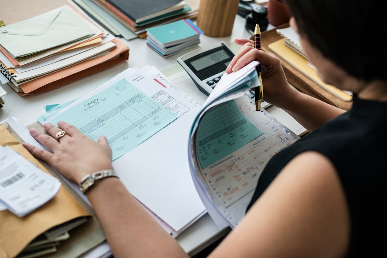 Woman Reviews Financial Paperwork in an Office Setting
