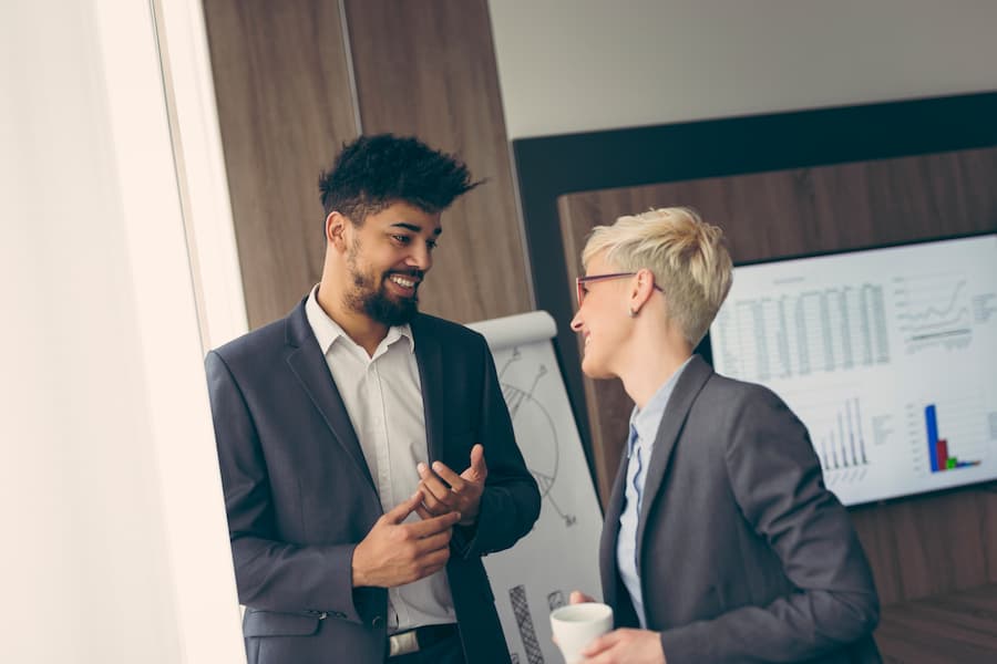 Business Colleagues Discussing Data in Modern Office
