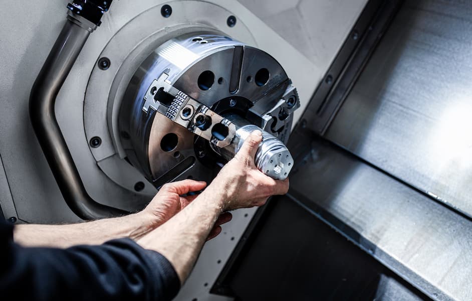 Close up of CNC machinist cutting metal