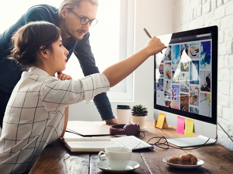 Graphic Designers Working Together at an Office