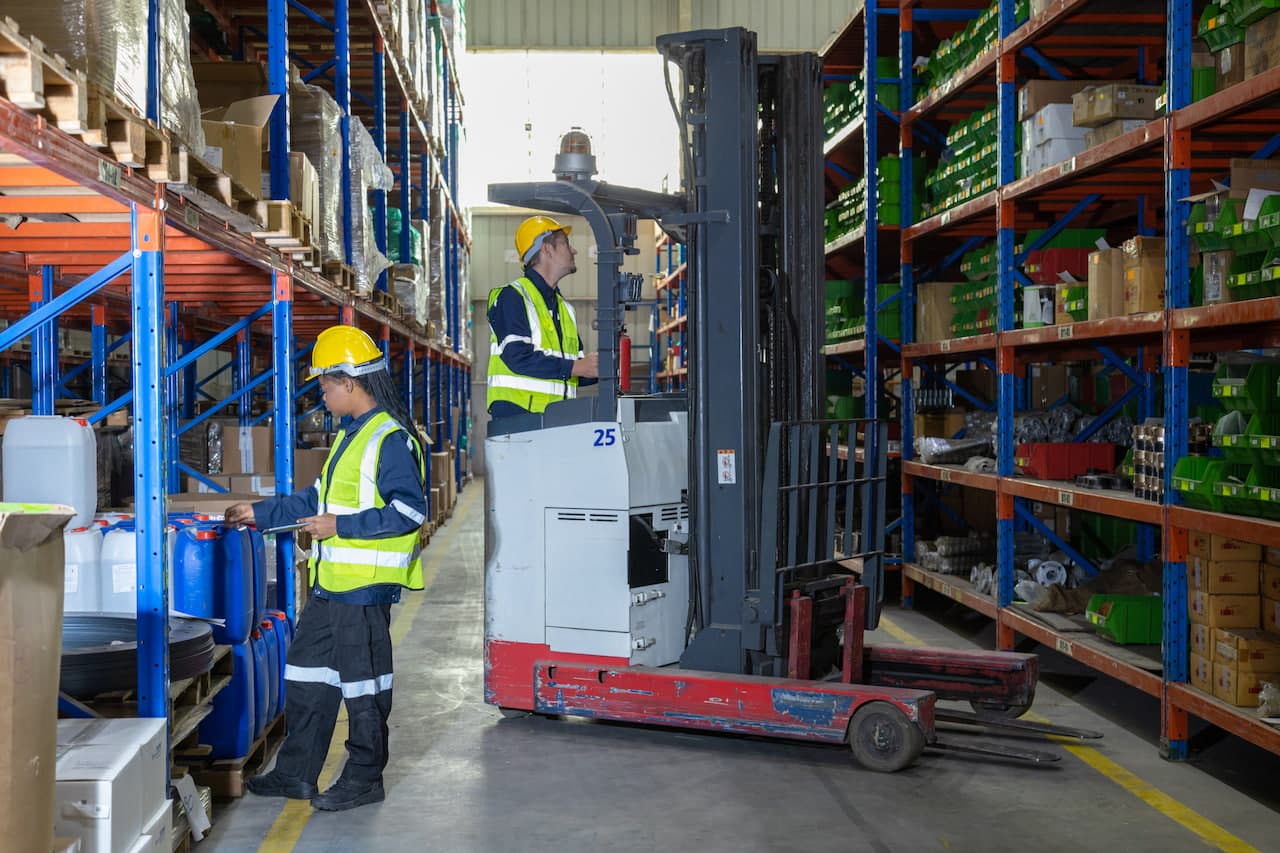 A forklift operator and a order picker during operations in a Brisbane warehouse