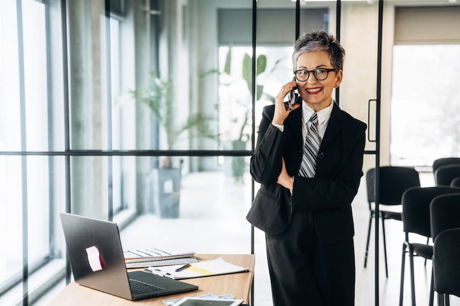 Confident Businesswoman on Cellphone in Modern Office