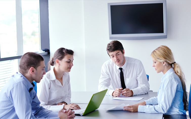 Staff providing recruitment services in a boardroom