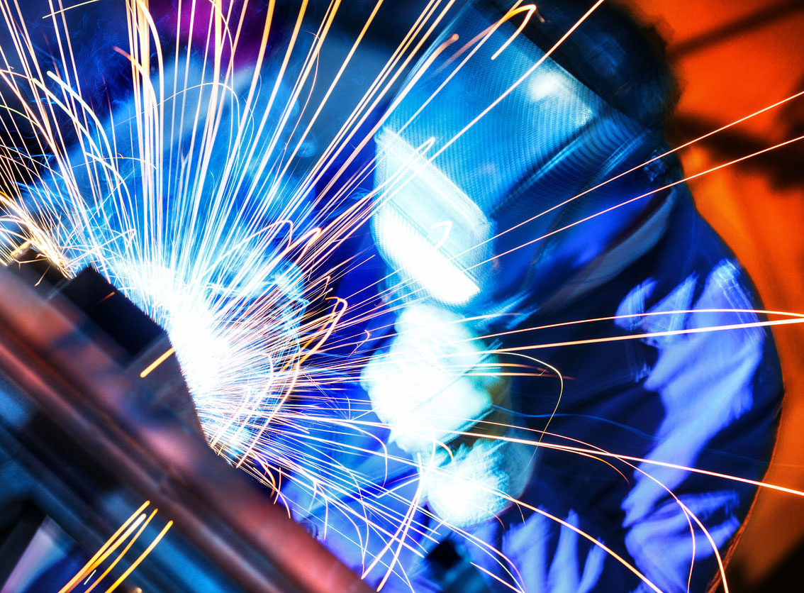 metal work welder with blue sparks